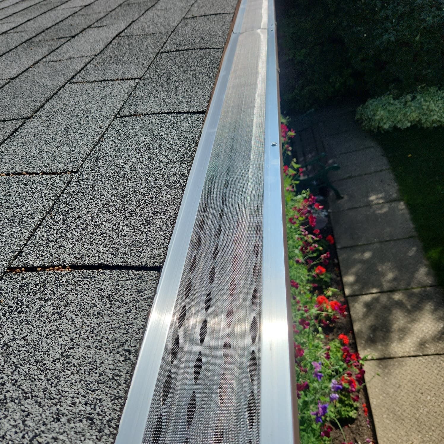 Close-up of a leaf gutter guard installed on a home